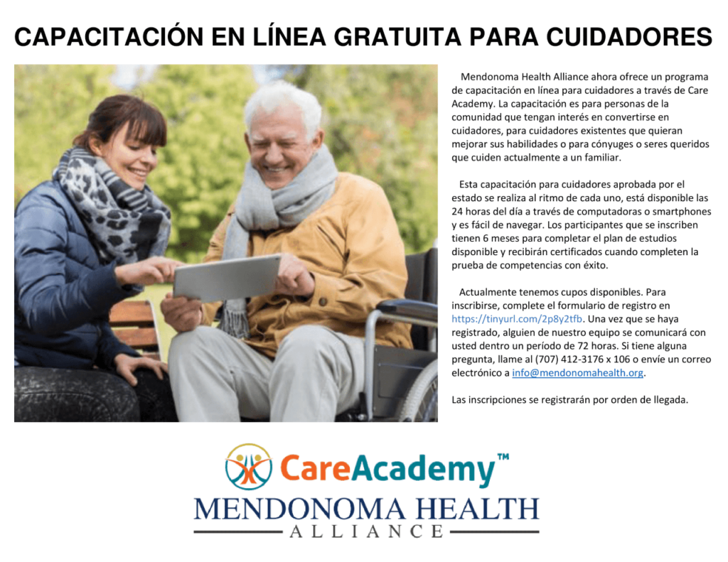 Gray haired man in wheelchair, with yellow sweater and gray scarf, holding a lap top computer. Beside him sitting on a park bench is a young lady with a heavy coat and scarf showing the man something on the computer. Advertising a free online caregiver class in Spanish through mendonoma health alliance.