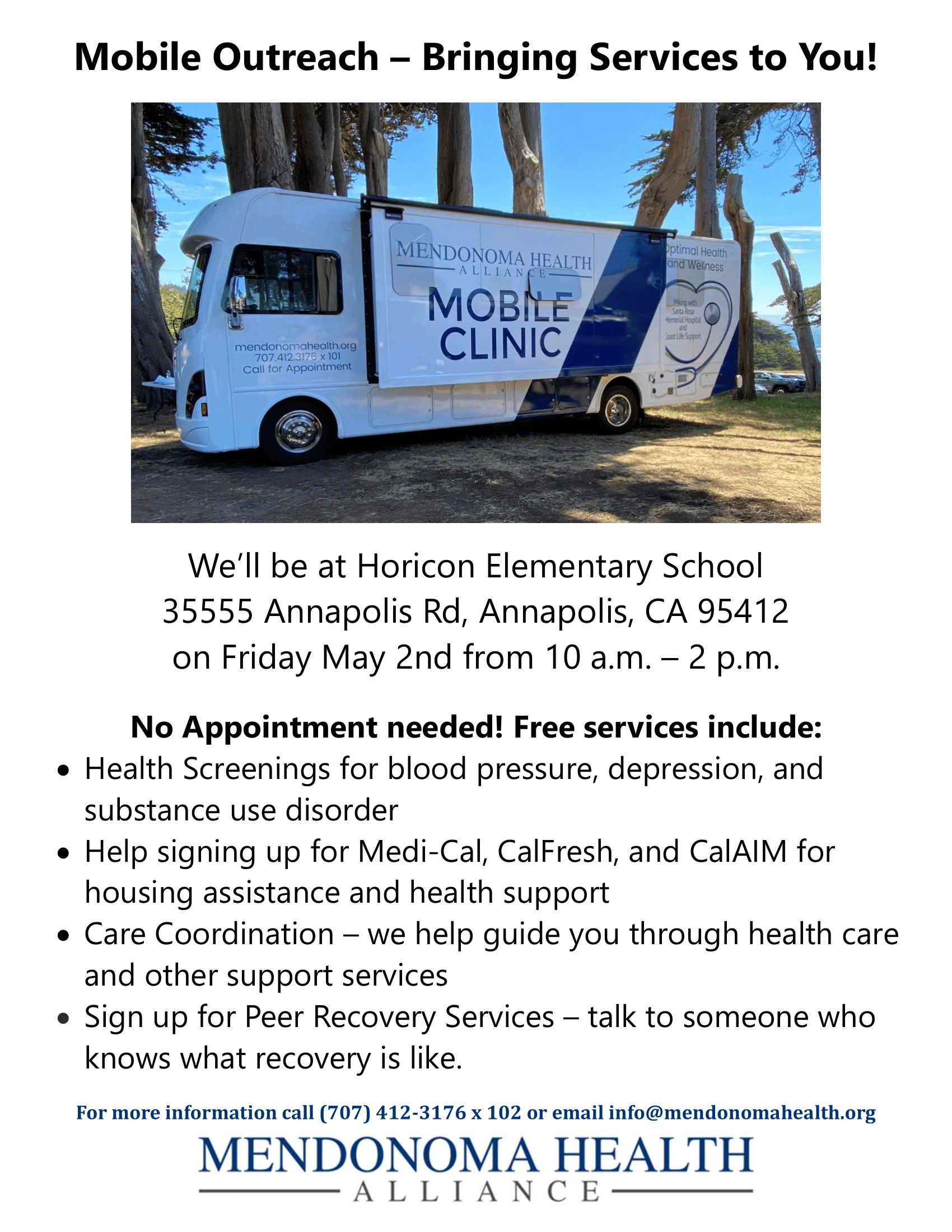 Photo of Mobile Clinic parked by 9 trees in a grassy area that is yellowed. Shows side of vehicle with pop out opened that says Mendonoma Health Alliance Mobile Clinic. There's a stethoscope on the back end of the vehicle that's shaped like a heart in blue, gray and white. It is a sunny day & a small blue patch of ocean is showing in the background. It is partially in the shade.