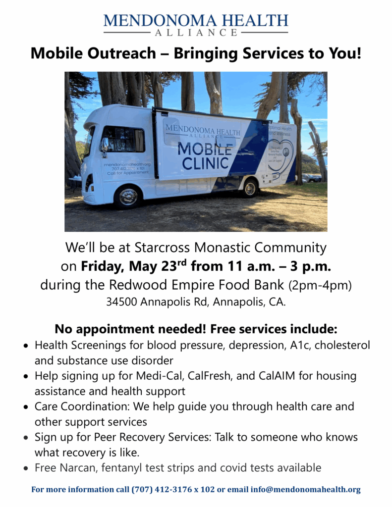 Mobile Outreach__Starcross Monastic Community 2025-05-23-1 Resized Photo of Mobile Clinic parked by 9 trees in a grassy area that is yellowed. Shows side of vehicle with pop out opened that says Mendonoma Health Alliance Mobile Clinic. There's a stethoscope on the back end of the vehicle that's shaped like a heart in blue, gray and white. It is a sunny day & a small blue patch of ocean is showing in the background. It is partially in the shade.